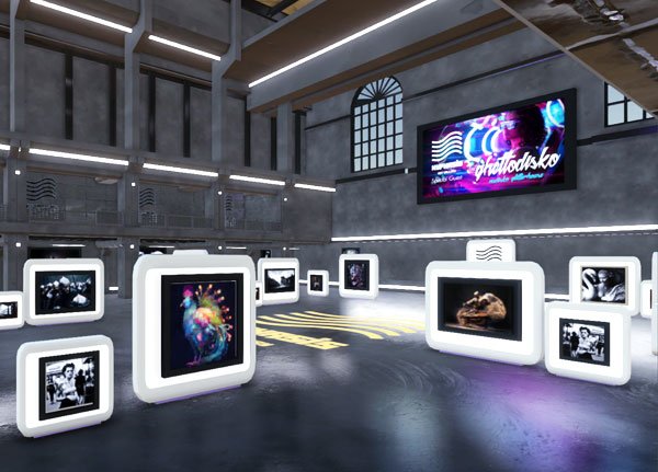 A digital art gallery within the metaverse, featuring various NFT artworks displayed on illuminated stands. The space has a modern industrial design with high ceilings and large windows. The name of the space is Hypjhasis in the Uttopion Metaverse. A large screen on the wall displays a vibrant promotional graphic for an exhibit, adding to the immersive experience at Cyclone Gallery.